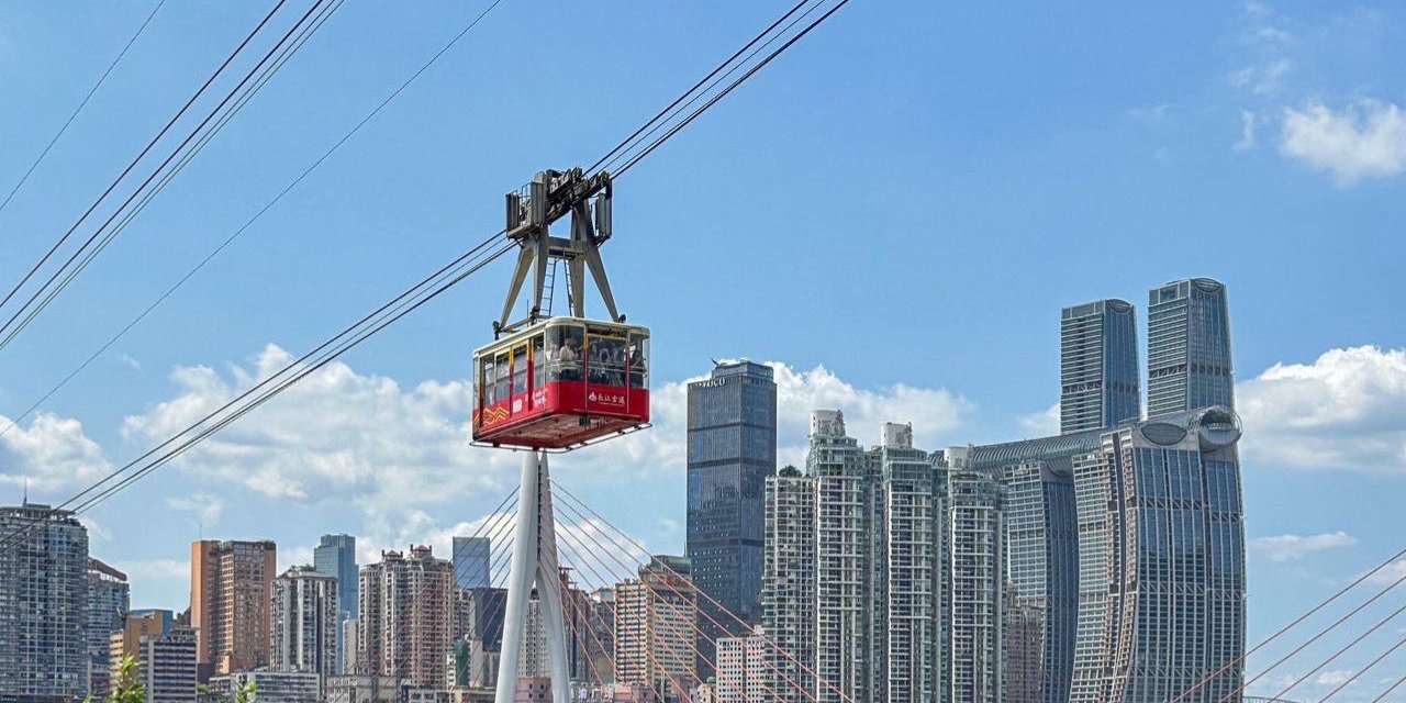Yangtze River Cableway cabin crossing the river against the Chongqing skyline