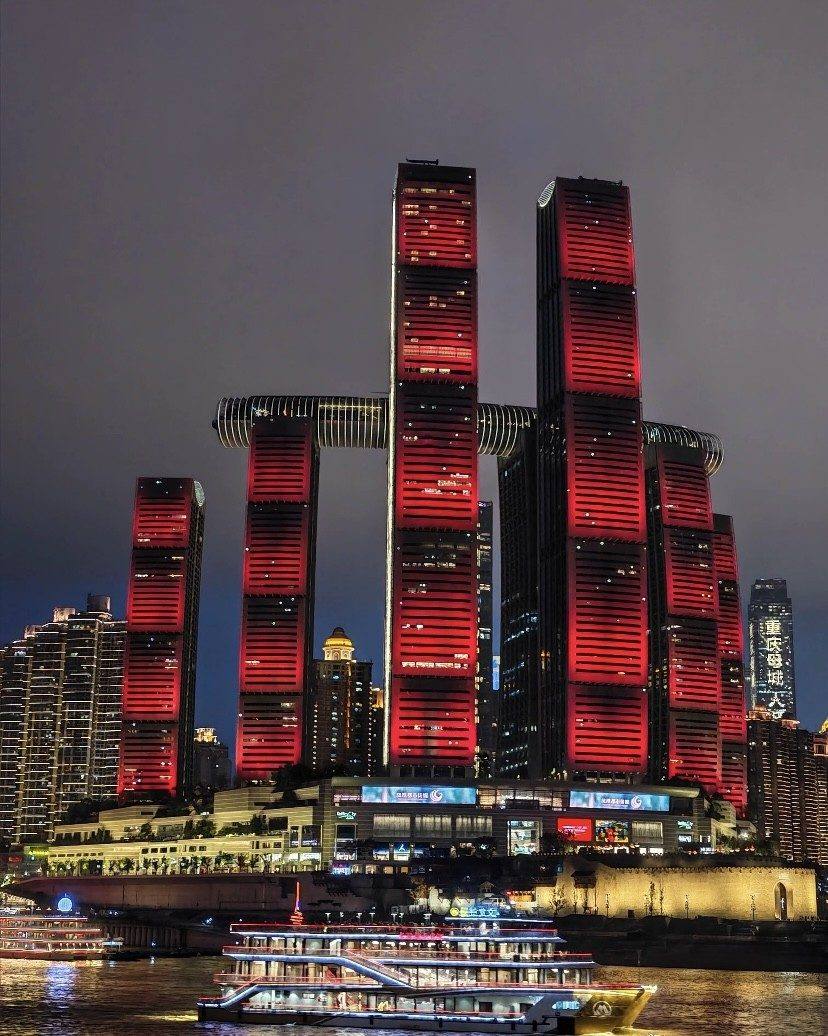 Yangtze river night cruise past the Chongqing neon skyline
