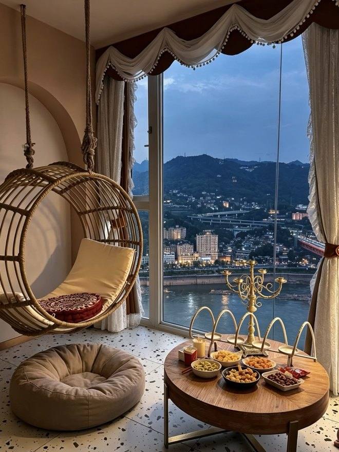 Hanging chairs and river view in a premium Chongqing hotel room