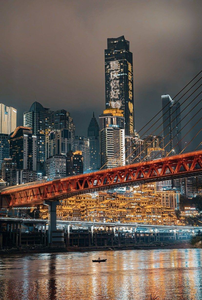 Chongqing neon skyline wrapped around the rivers at night