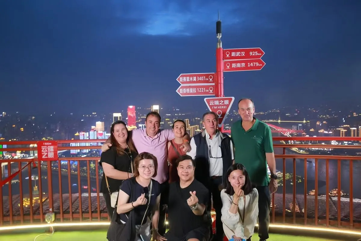 Anjia guests on a Chongqing skydeck above the glowing night skyline