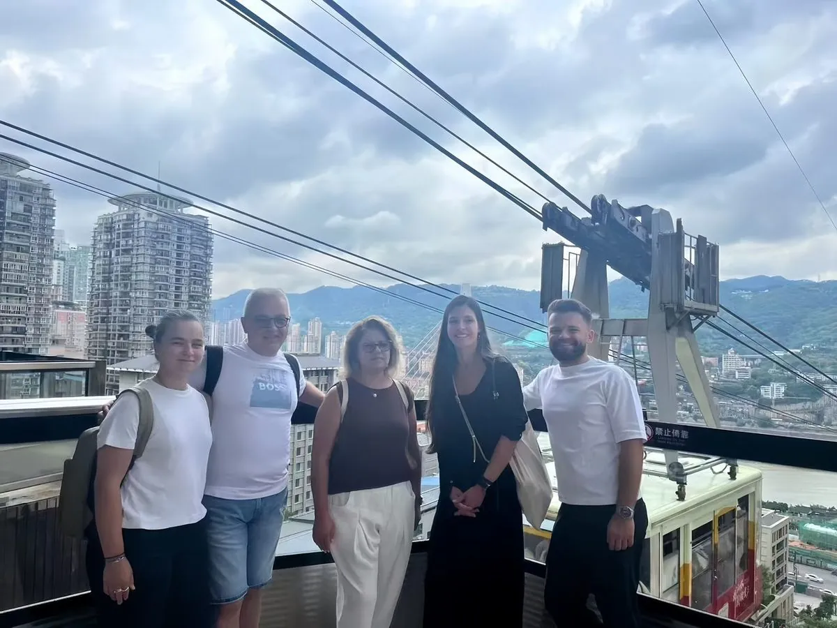 International travellers on an Anjia cable car ride over the Yangtze in Chongqing